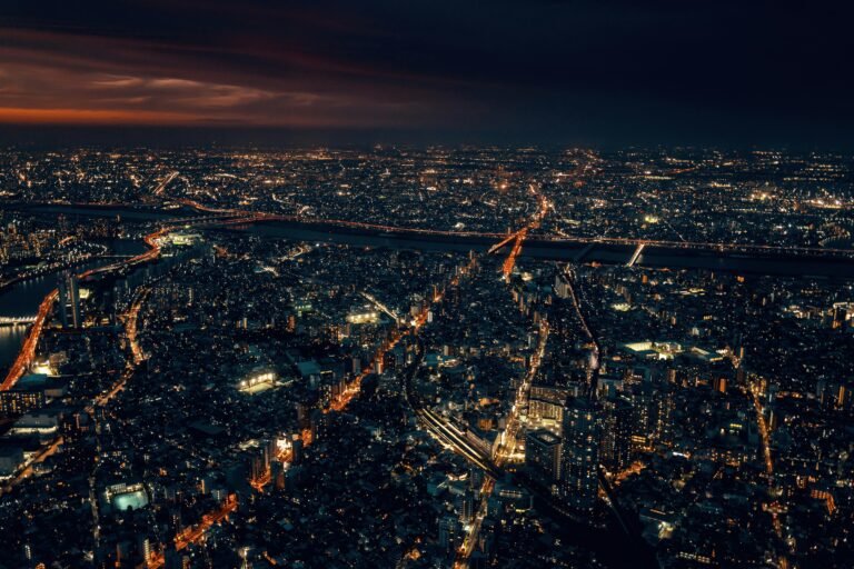 Breathtaking aerial cityscape of Tokyo, Japan, illuminated at night with vibrant urban lights.